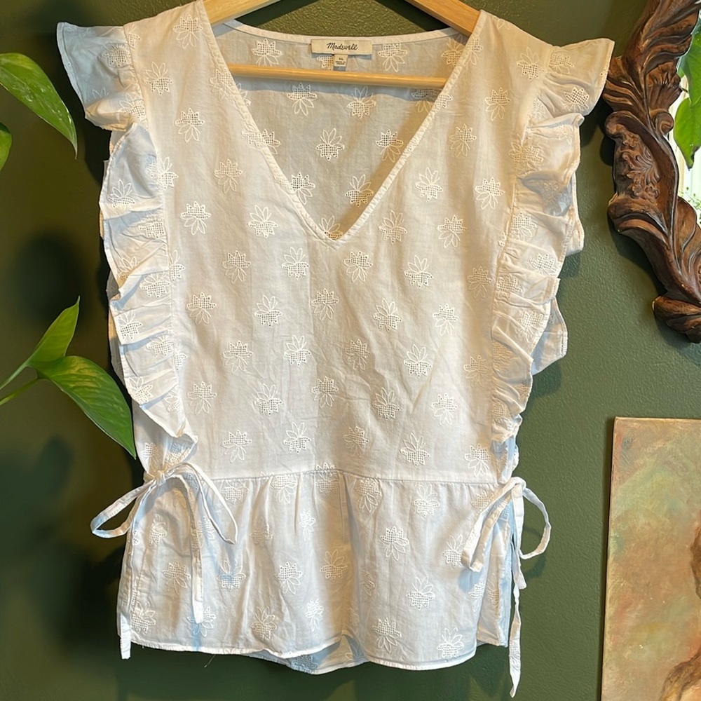 Eyelet peplum blouse